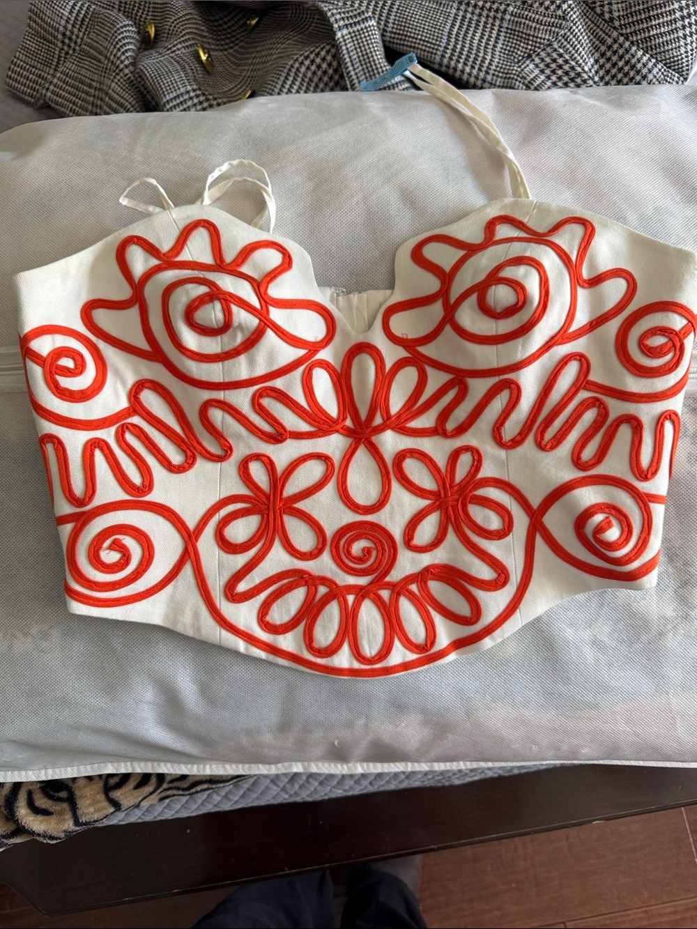 White Strapless Bustier Top with orange Embroidered Swirl Design